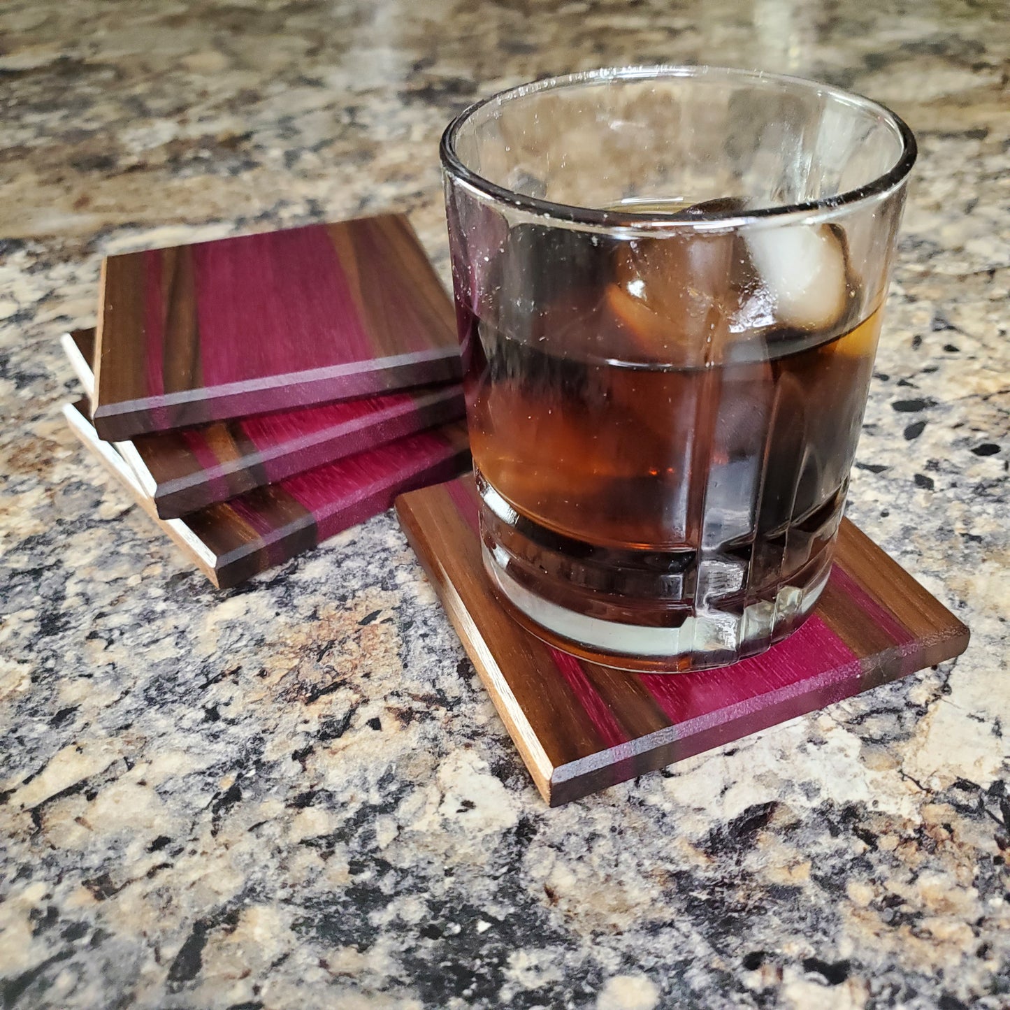 Premium handmade Pasque coasters made from walnut and purple heart by Lone Wolf Wood Designs
