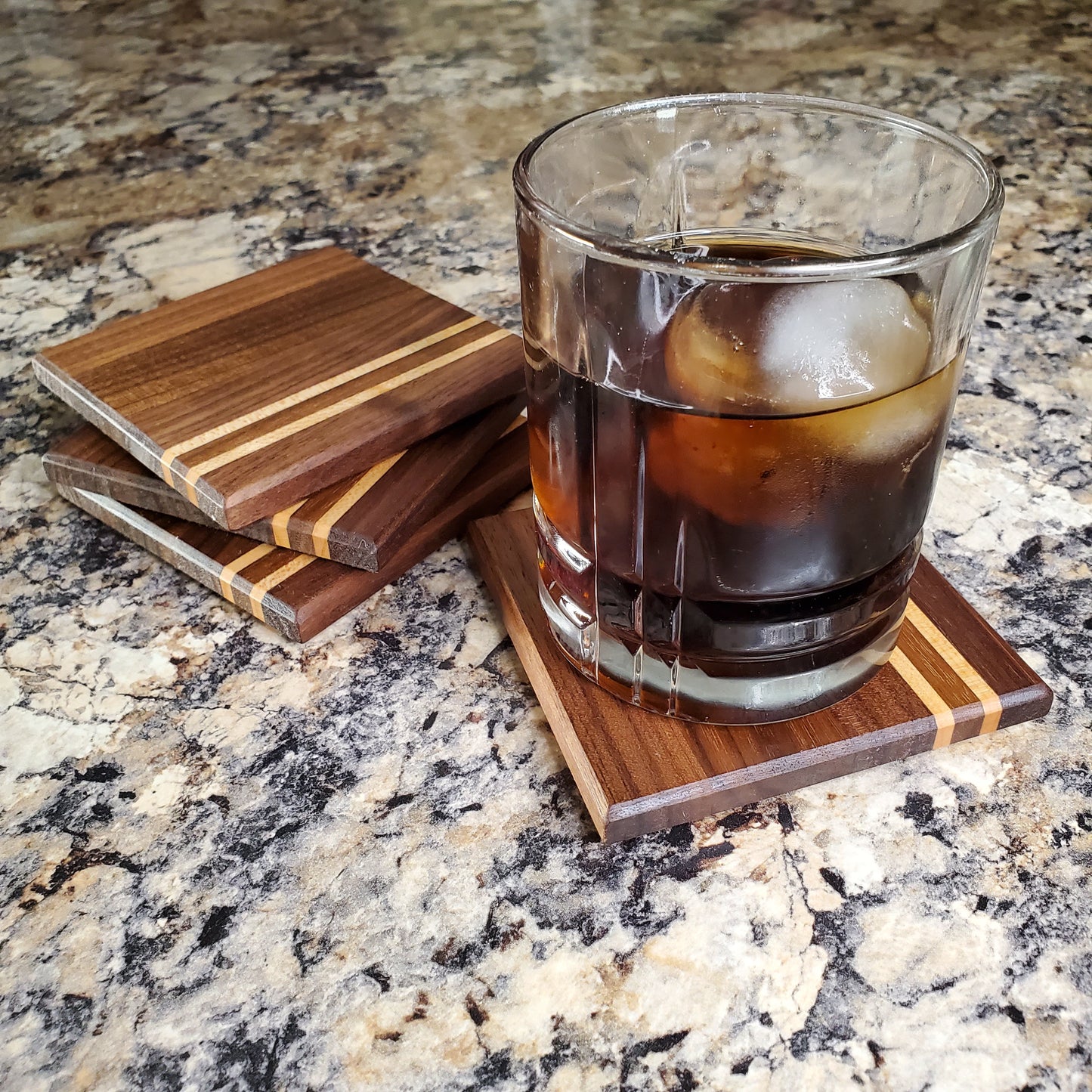 Classic coasters, made of primarily walnut with two maple stripes