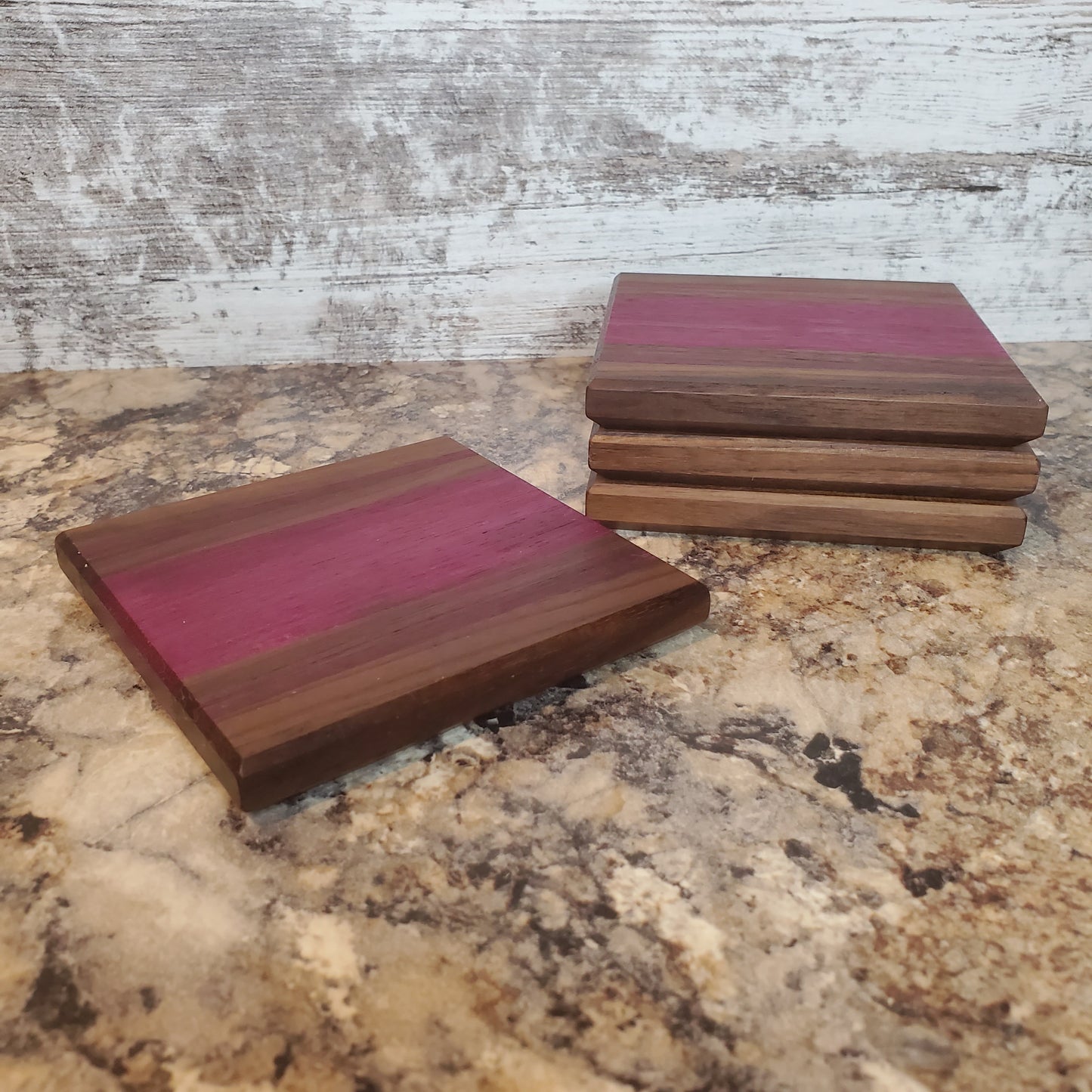 Premium handmade Pasque coasters made from walnut and purple heart by Lone Wolf Wood Designs