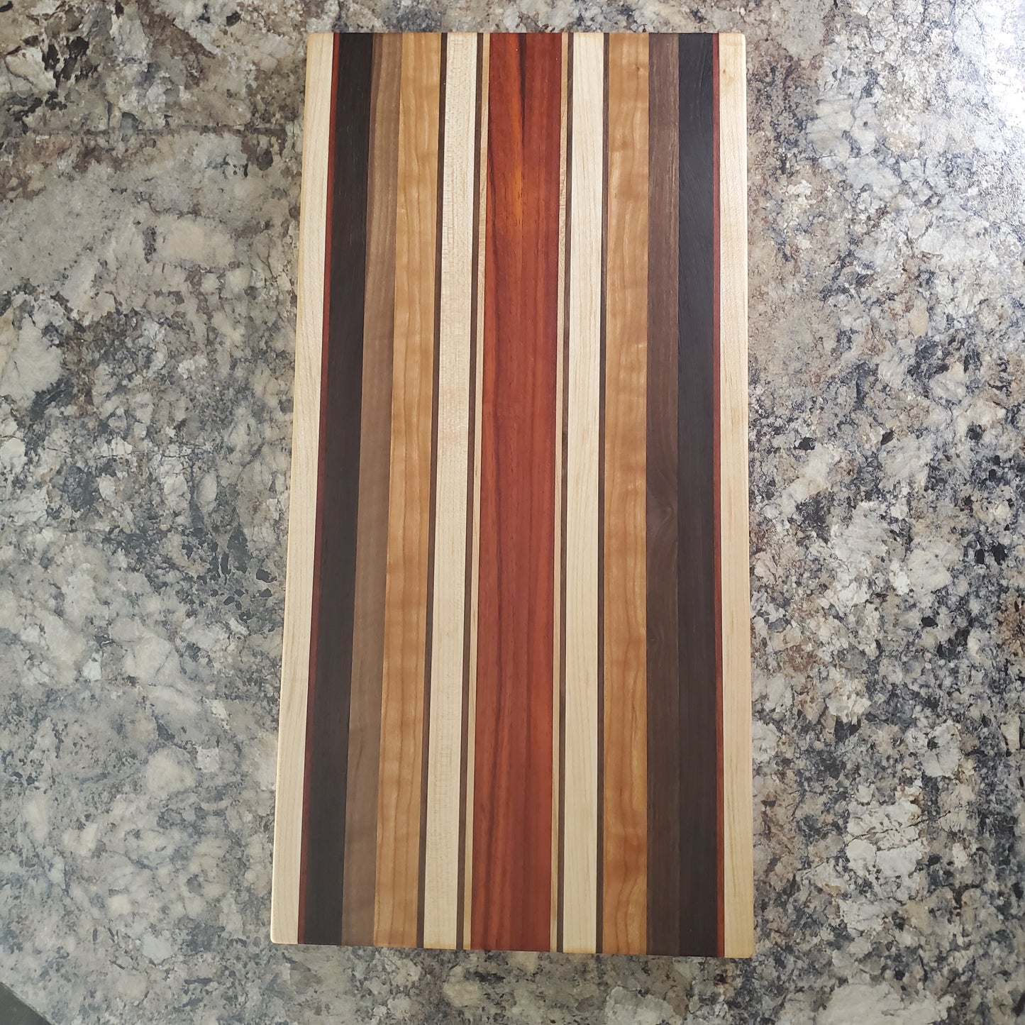 Signature Series Monarch cutting board made from maple, cherry, walnut, wenge and padauk by Lone Wolf Wood Designs