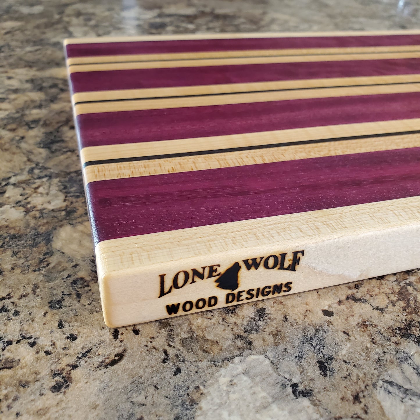 Signature Series Semper Fi cutting board made from maple, purple heart, and wenge by Lone Wolf Wood Designs