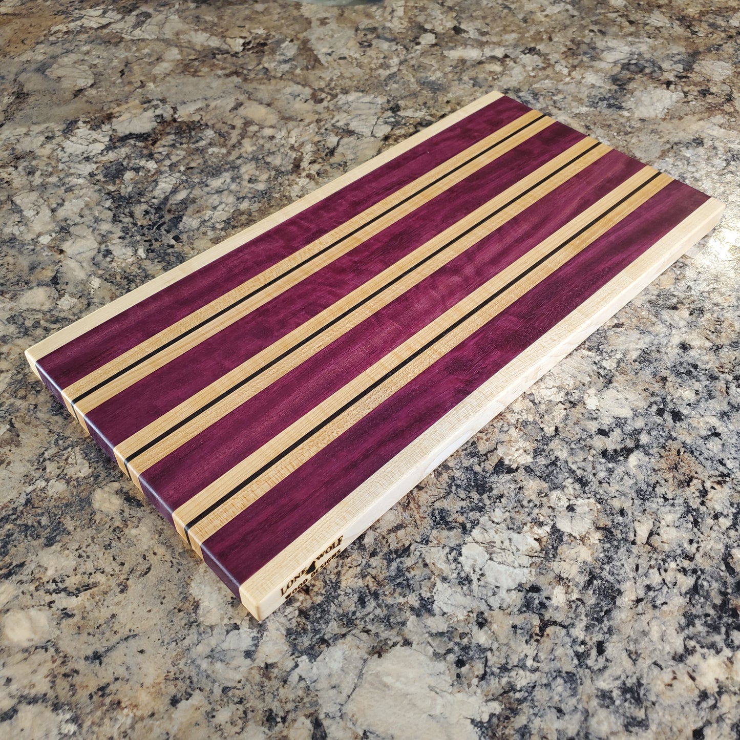 Signature Series Semper Fi cutting board made from maple, purple heart, and wenge by Lone Wolf Wood Designs