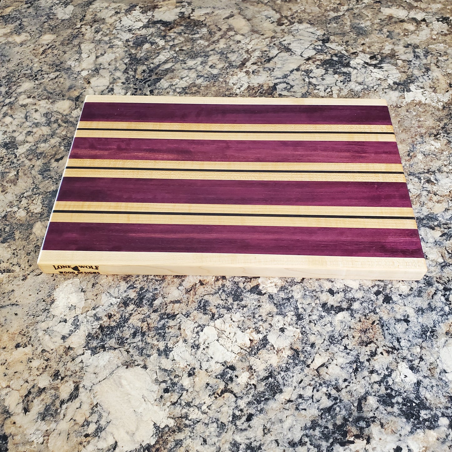 Signature Series Semper Fi cutting board made from maple, purple heart, and wenge by Lone Wolf Wood Designs