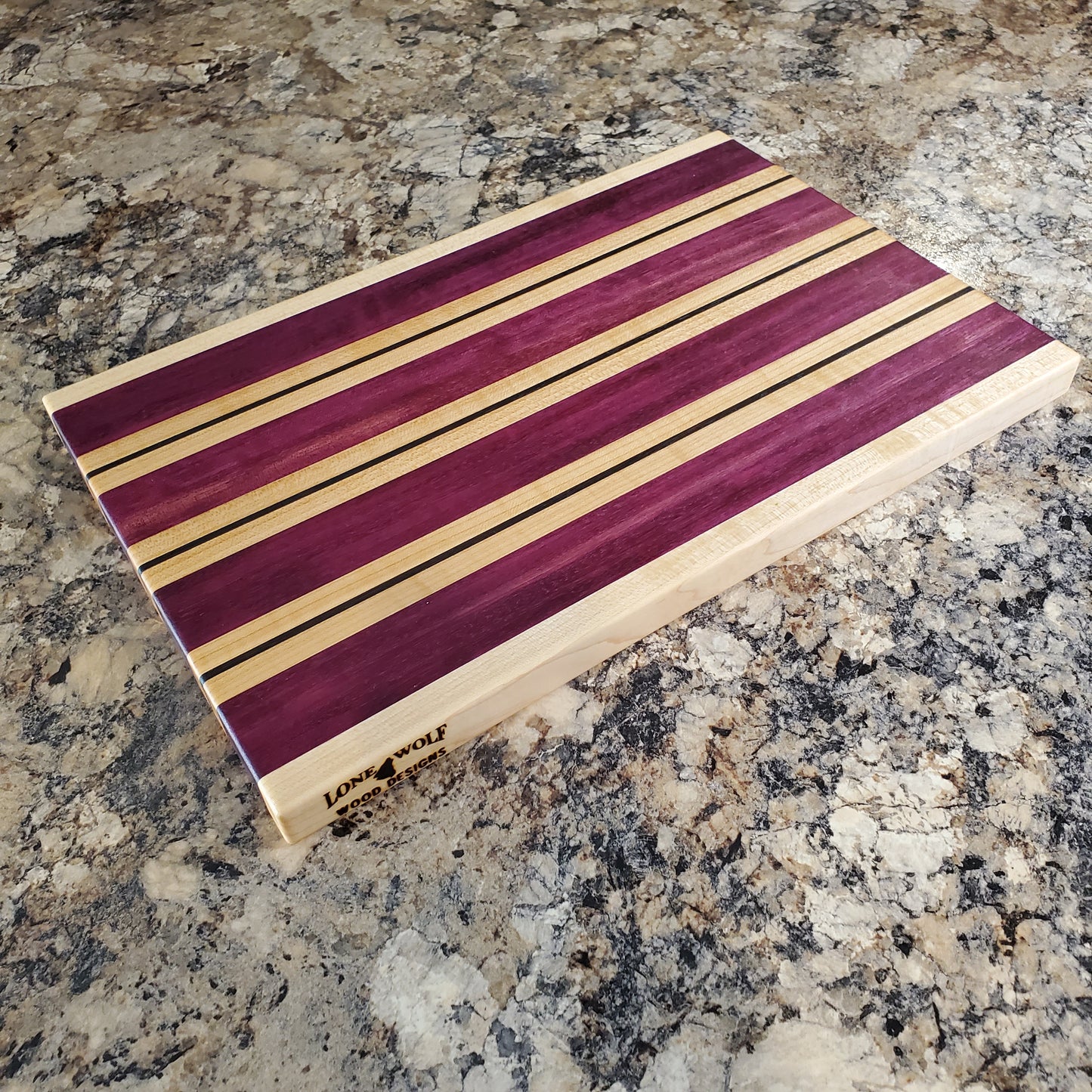 Signature Series Semper Fi cutting board made from maple, purple heart, and wenge by Lone Wolf Wood Designs