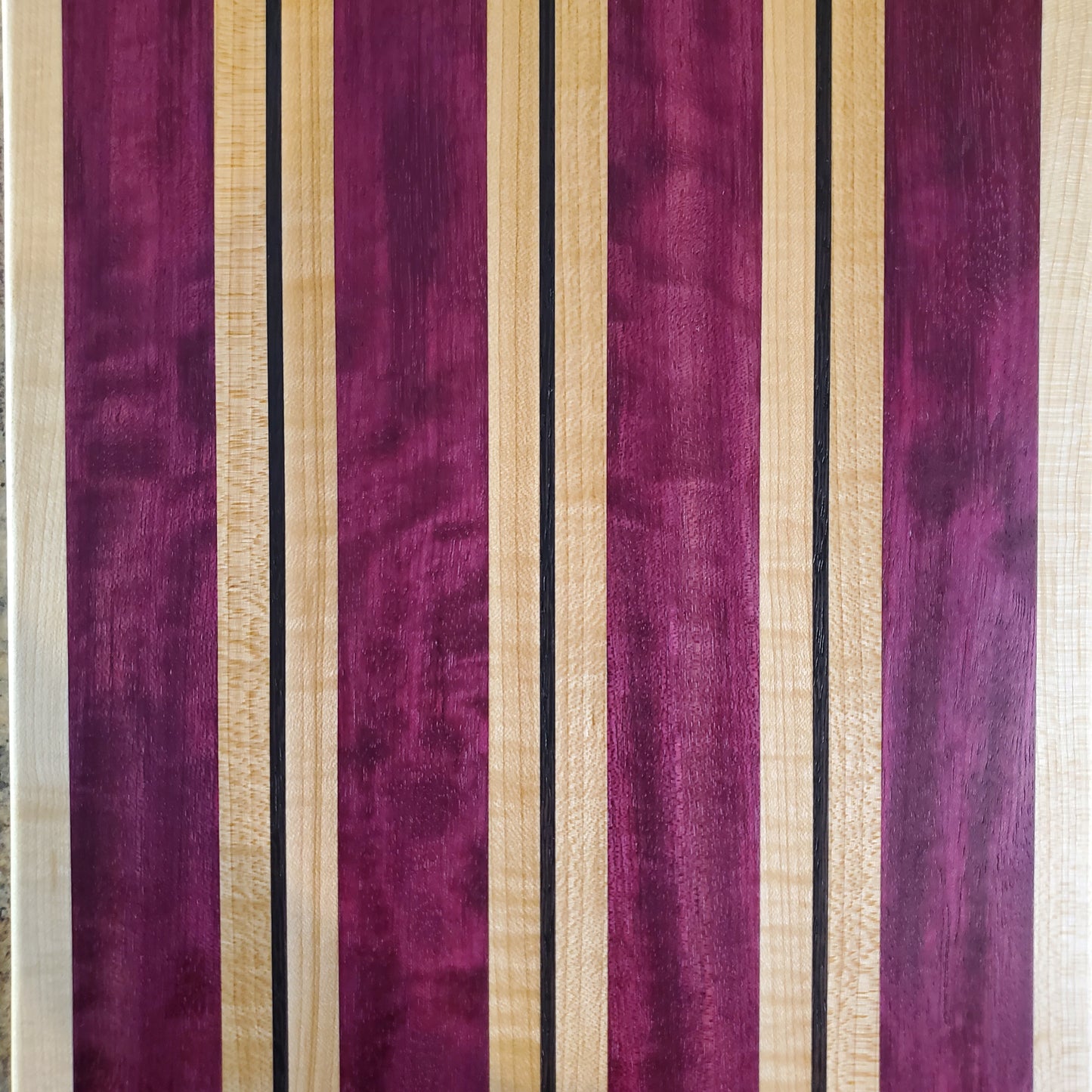 Signature Series Semper Fi cutting board made from maple, purple heart, and wenge by Lone Wolf Wood Designs