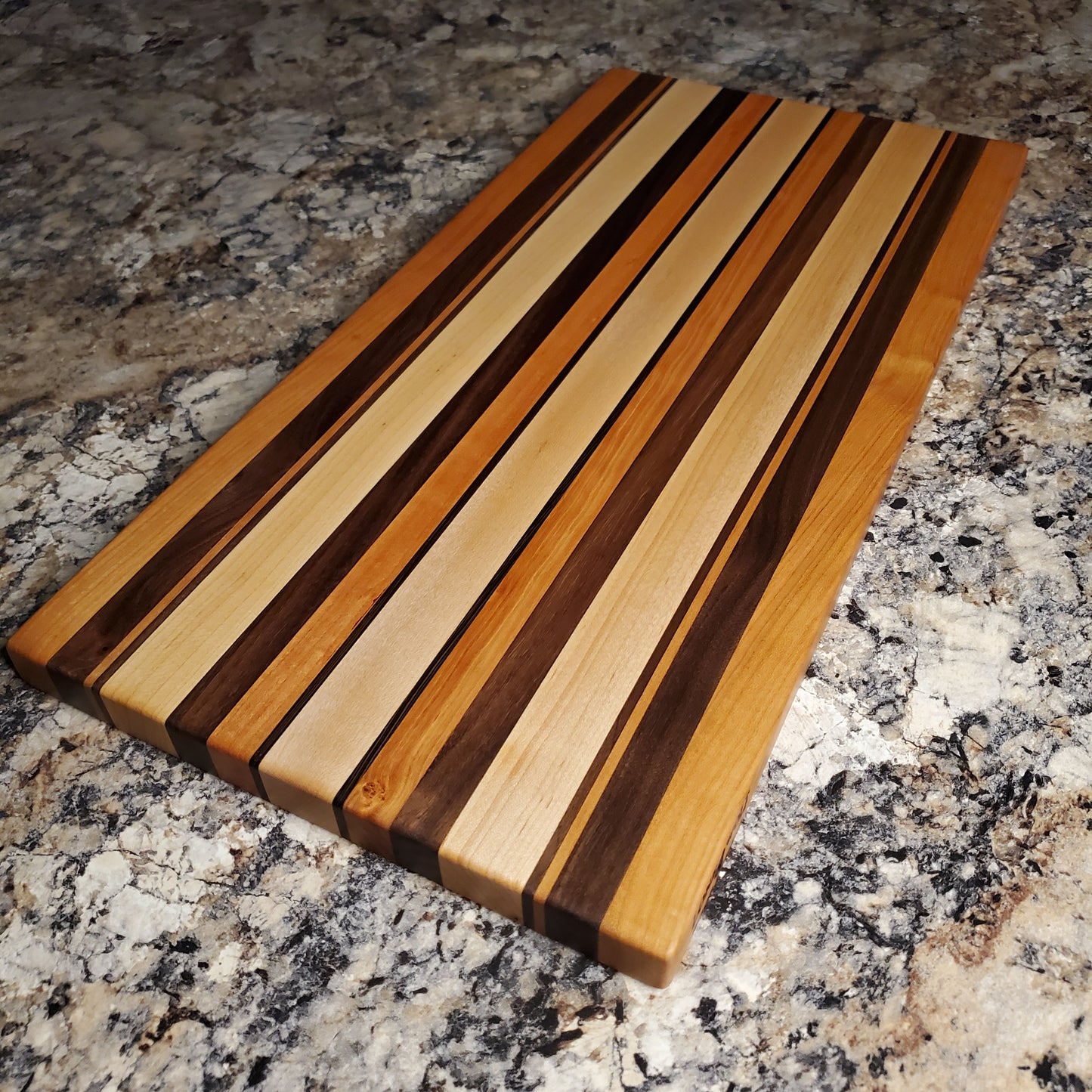 Signature Series Neutral Beauty cutting board made from maple, cherry, walnut and wenge by Lone Wolf Wood Designs