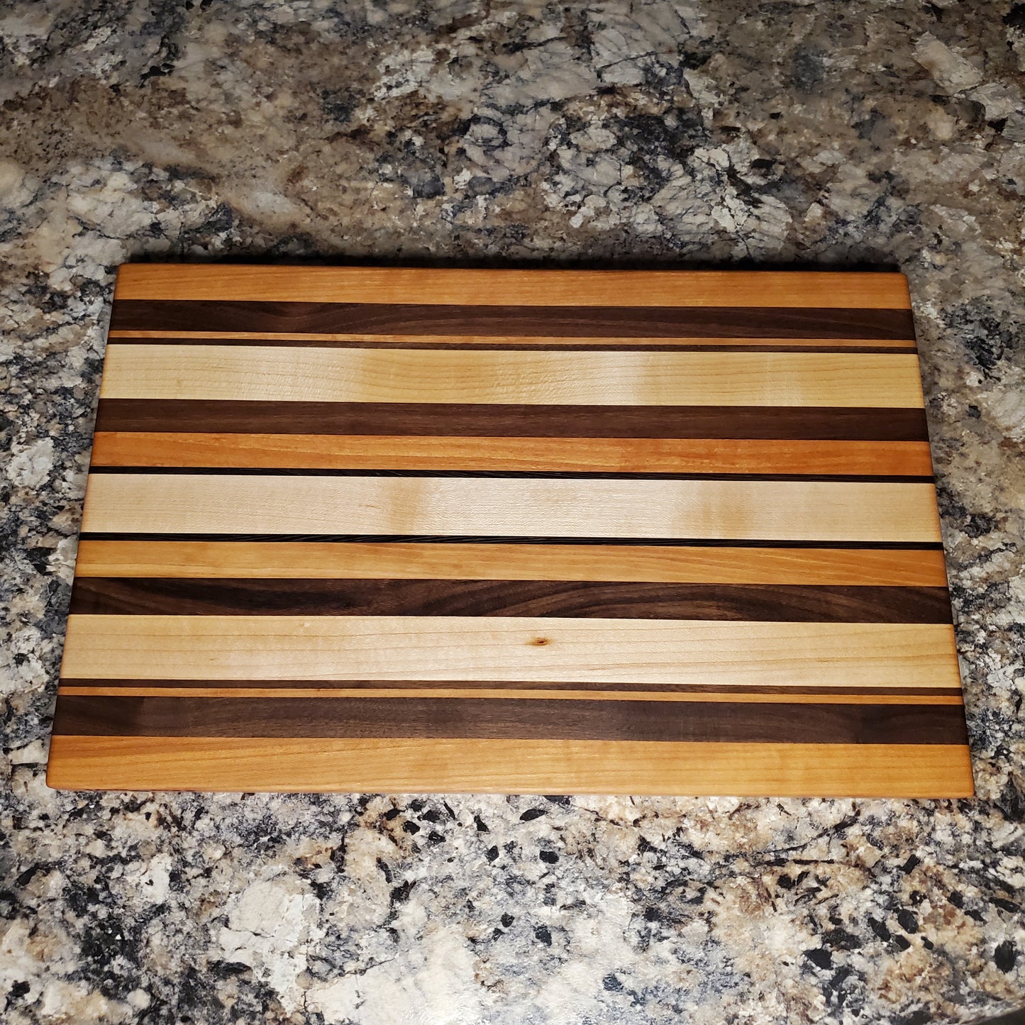 Signature Series Neutral Beauty cutting board made from maple, cherry, walnut and wenge by Lone Wolf Wood Designs