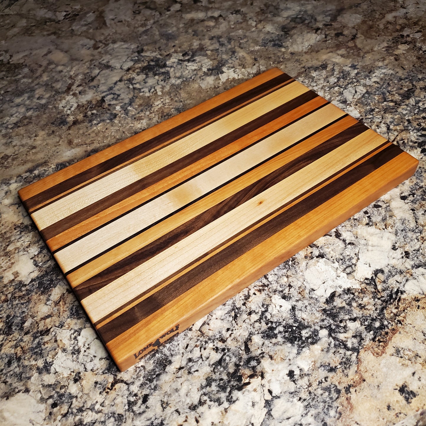 Signature Series Neutral Beauty cutting board made from maple, cherry, walnut and wenge by Lone Wolf Wood Designs