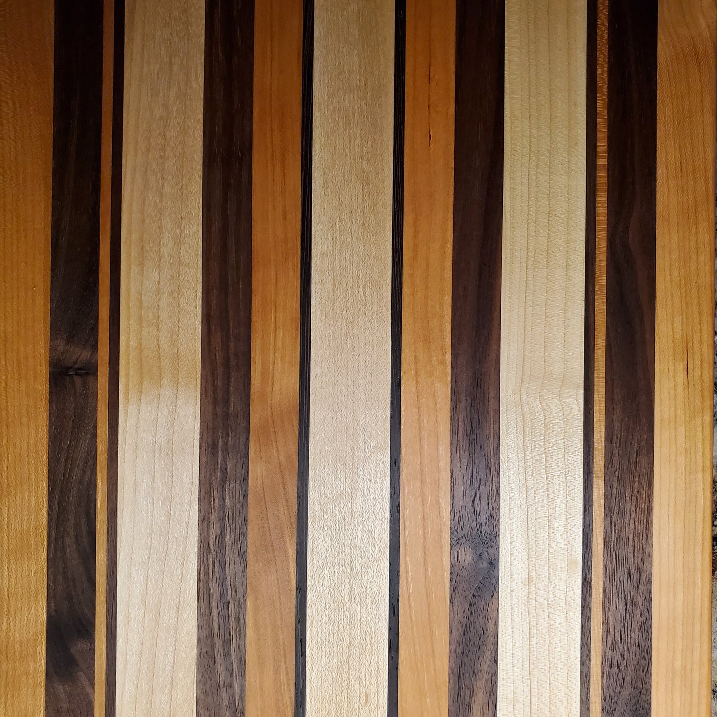 Signature Series Neutral Beauty cutting board made from maple, cherry, walnut and wenge by Lone Wolf Wood Designs