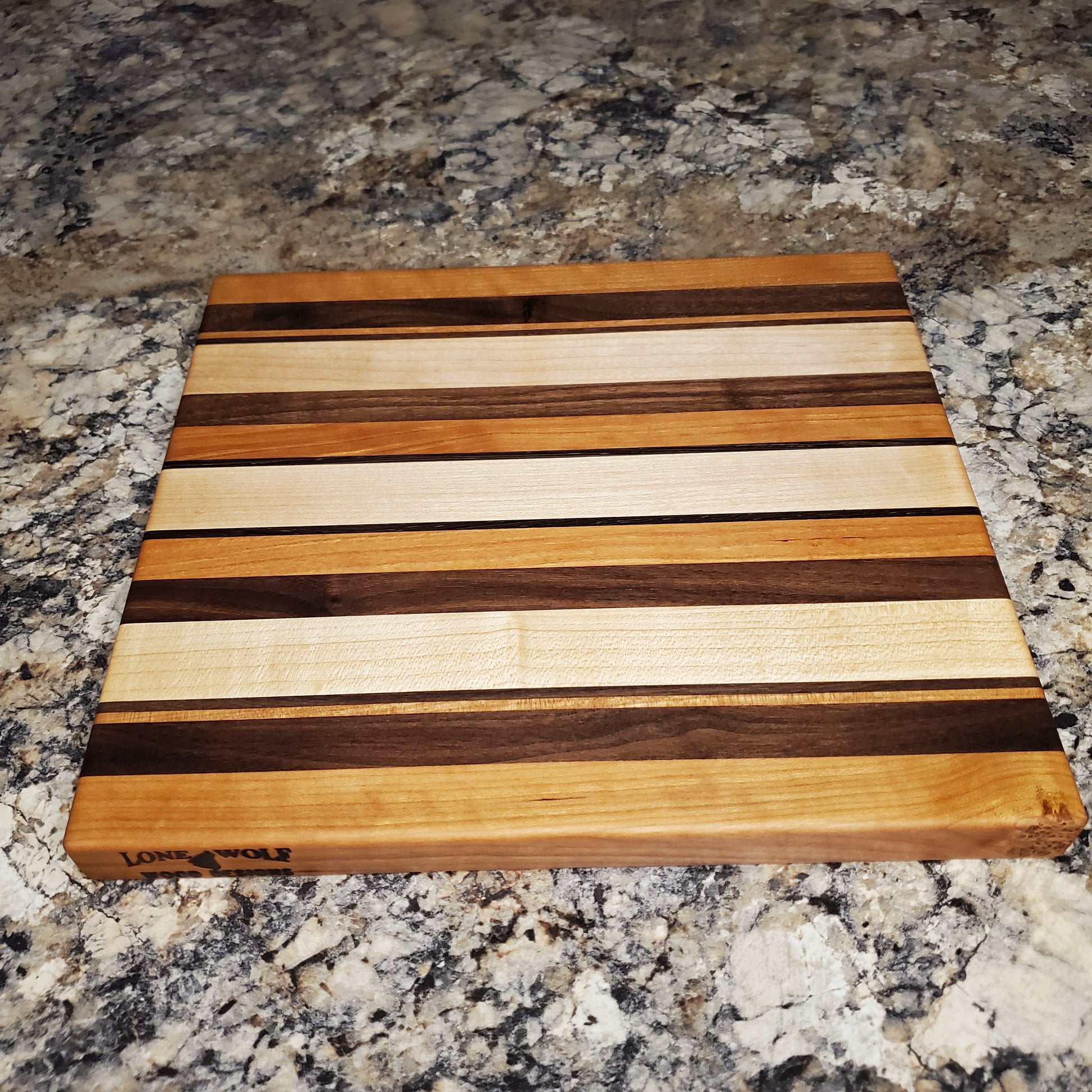 Signature Series Neutral Beauty cutting board made from maple, cherry, walnut and wenge by Lone Wolf Wood Designs