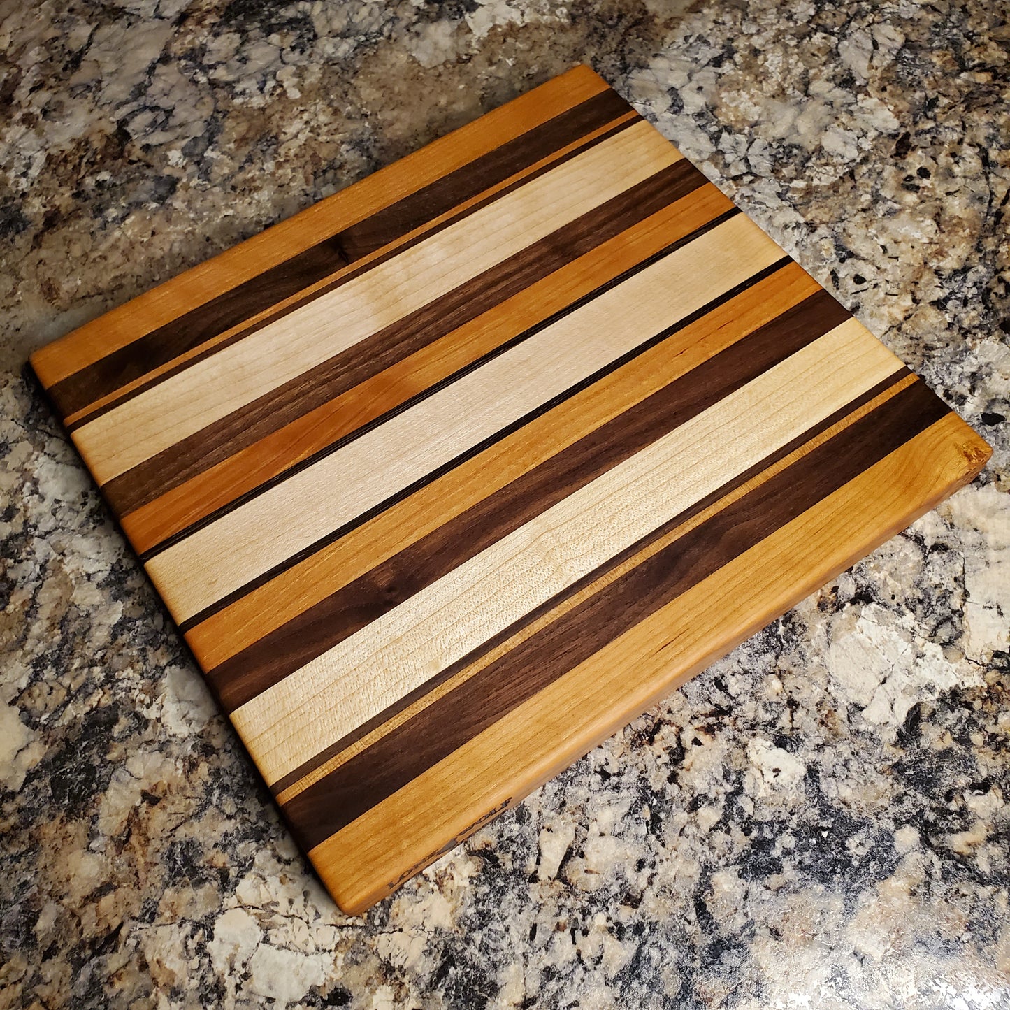 Signature Series Neutral Beauty cutting board made from maple, cherry, walnut and wenge by Lone Wolf Wood Designs