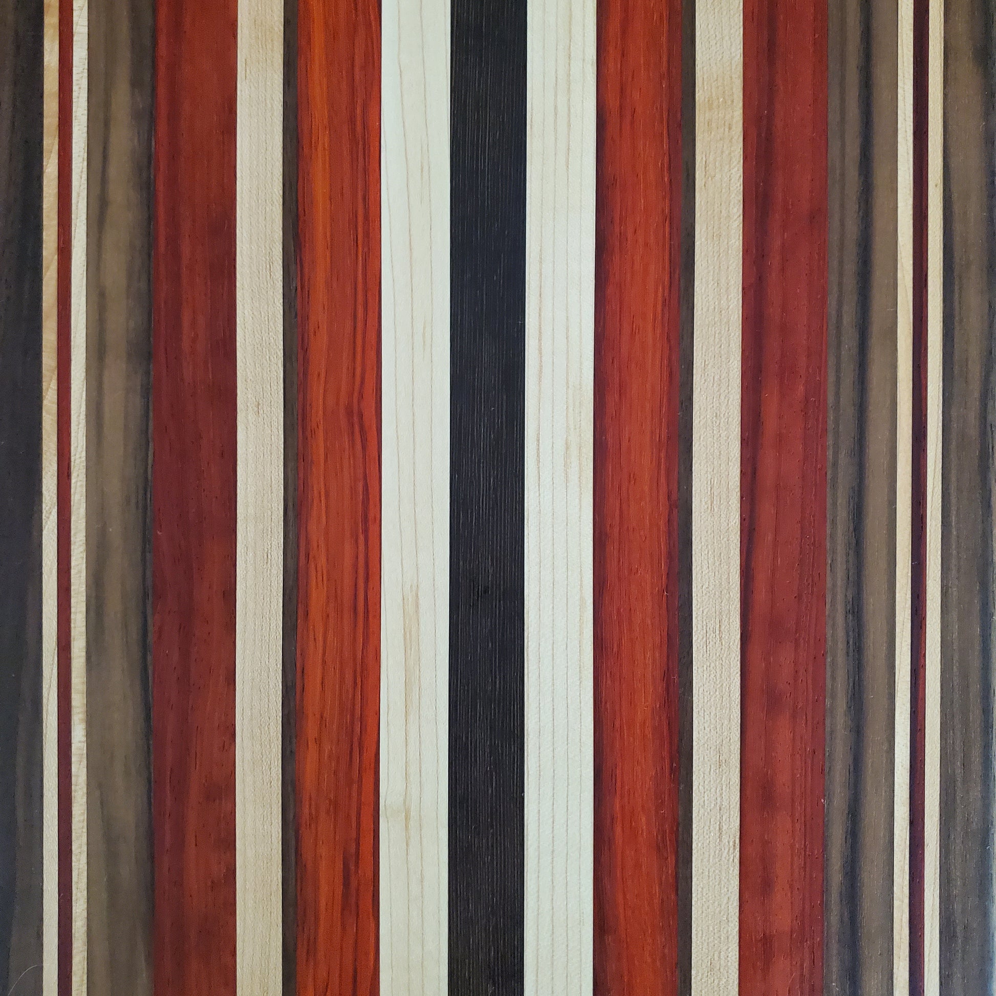 Signature Series October Fest cutting board made from maple, walnut, padauk, and wenge by Lone Wolf Wood Designs